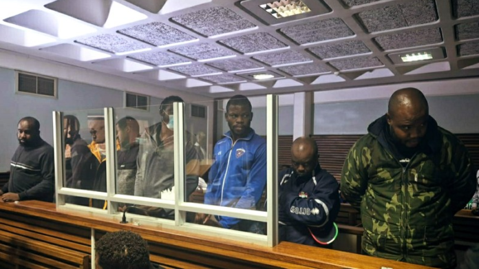 Eight Nigerians Accused Of Assaulting SAPS Officers And Damaging Police Station Denied Bail - The Times Post